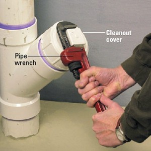 Using pipe wrench on cleanout cover